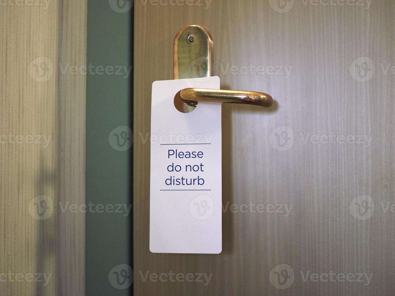 snälla stör inte skylten på hotellrumsdörren foto
