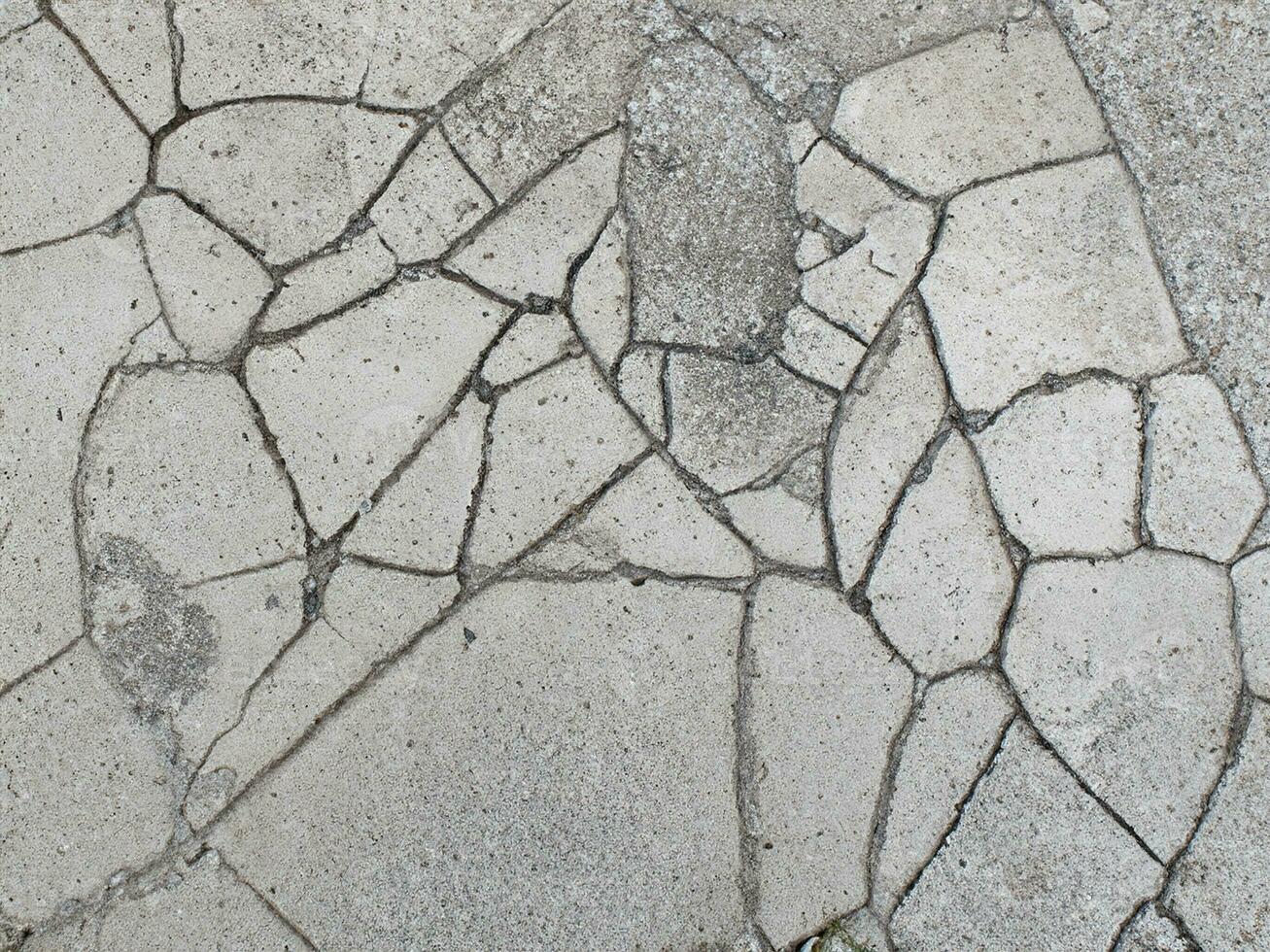stänga upp spricka cement golv textur foto