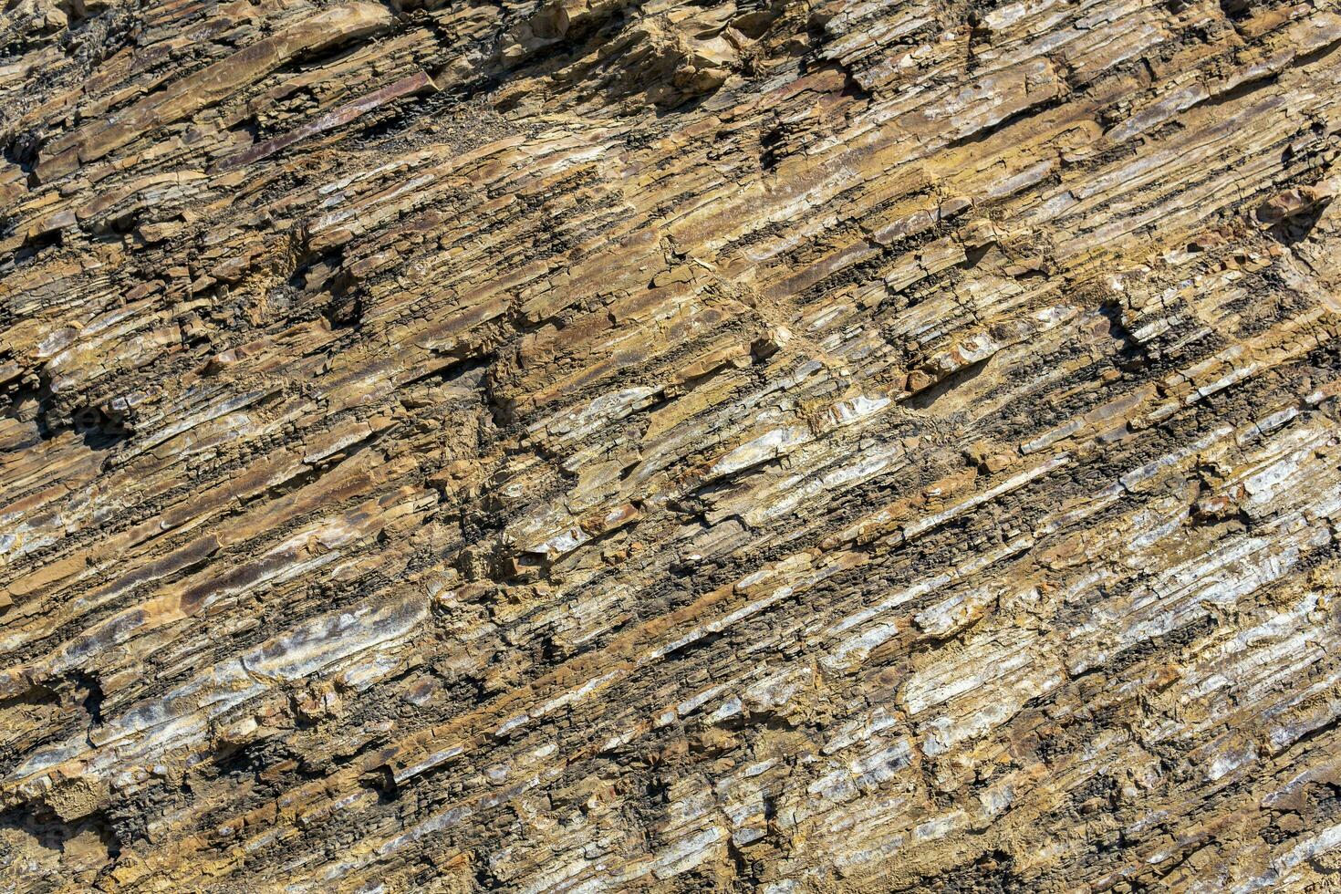 bakgrund, textur av skiktad brun sten foto