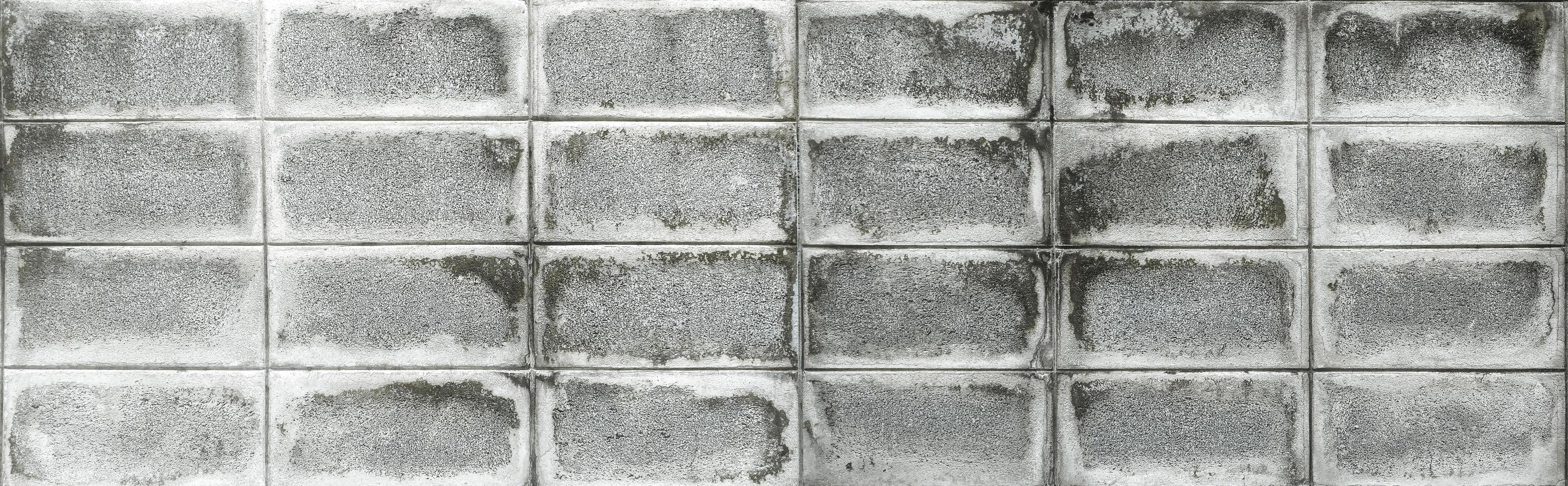 gammal och smuts cement tegel vägg mönster textur. foto