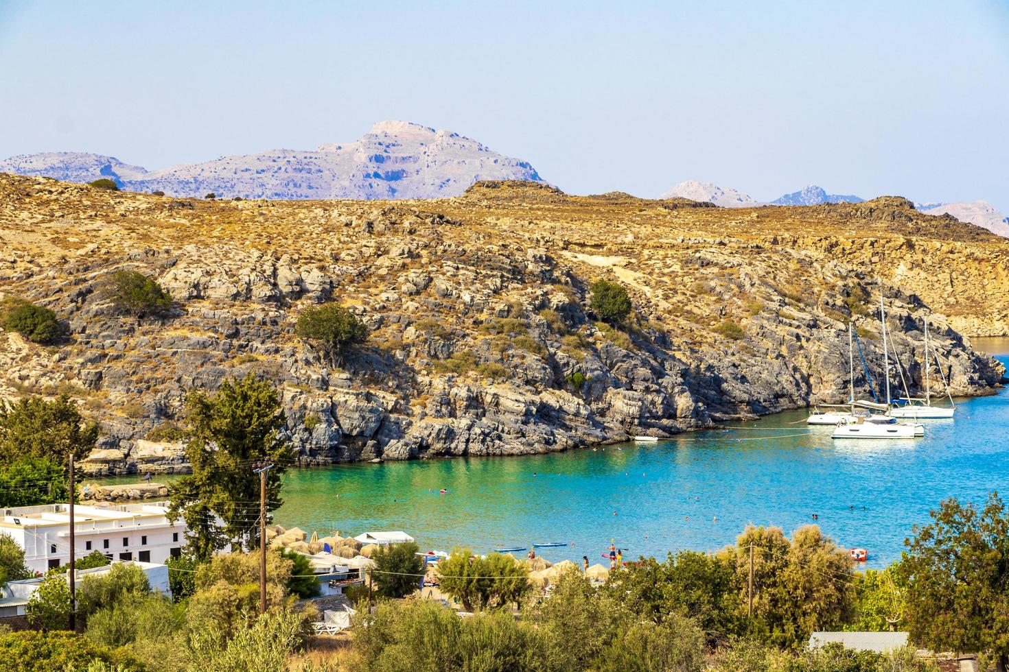 Lindos Beach Bay Panorama med turkos klart vatten Rhodos Grekland foto