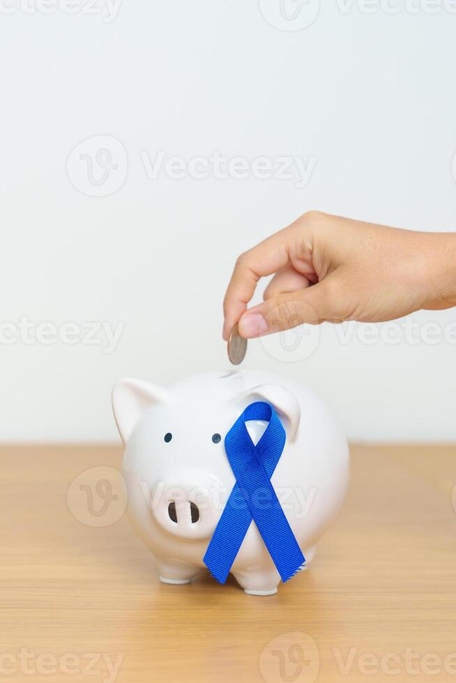 Mars kolorektal cancer medvetenhet månad, Marin blå band med nasse Bank för Stöd sjukdom liv. hälsa, donation, välgörenhet, kampanj, pengar sparande, fond och värld cancer dag begrepp foto