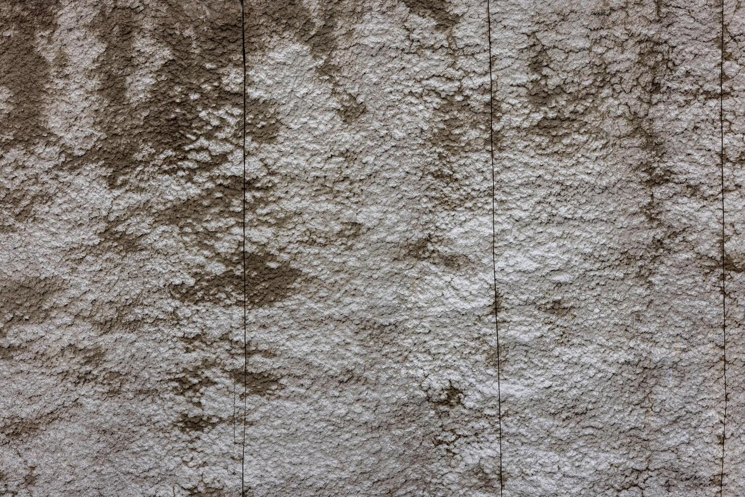 grov betong vägg med riden textur effekt och fick syn på nedskärningar foto