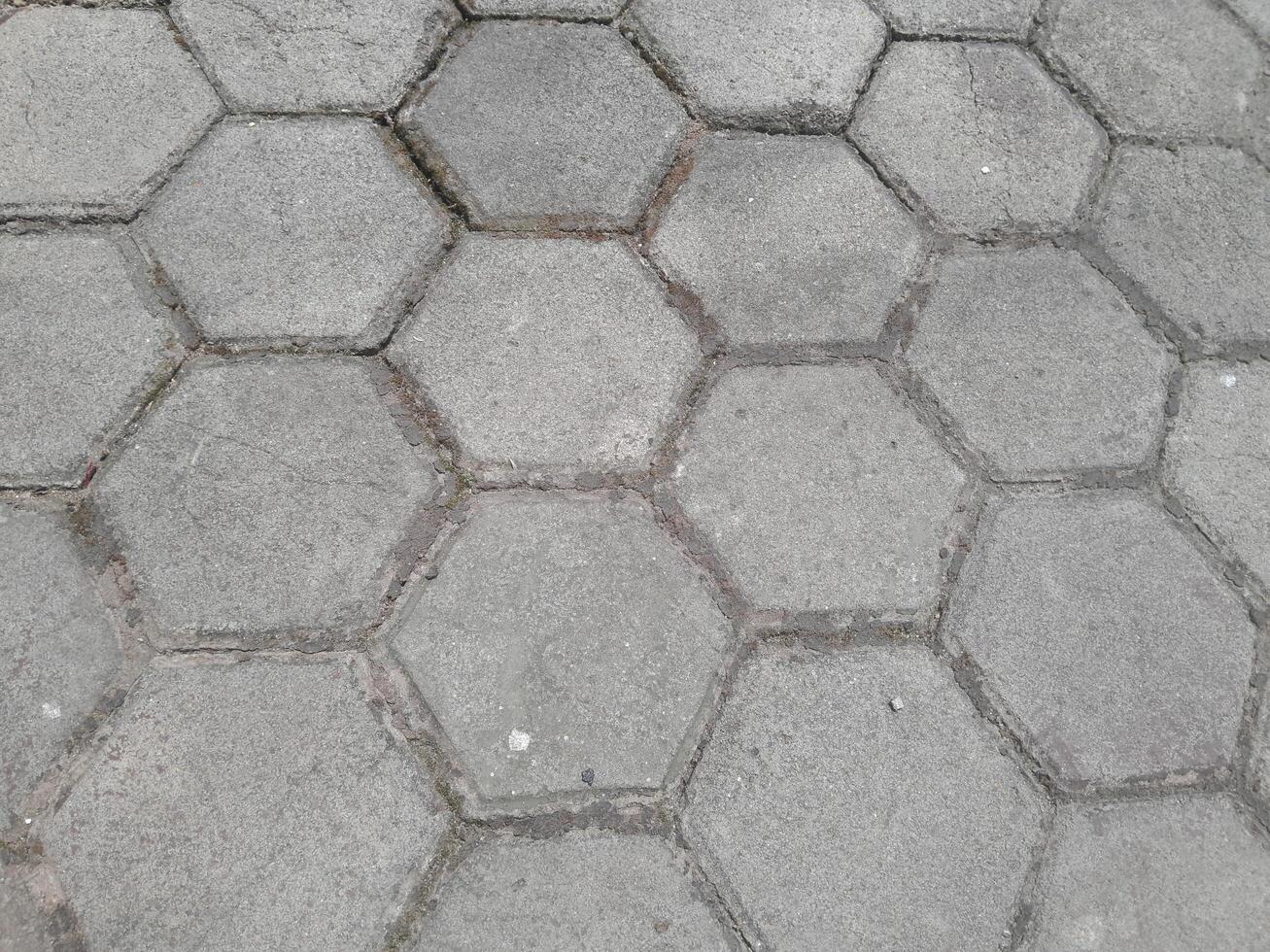 Foto av tegel gård golv. perfekt för tapet, bakgrund, baner, webb, reklam