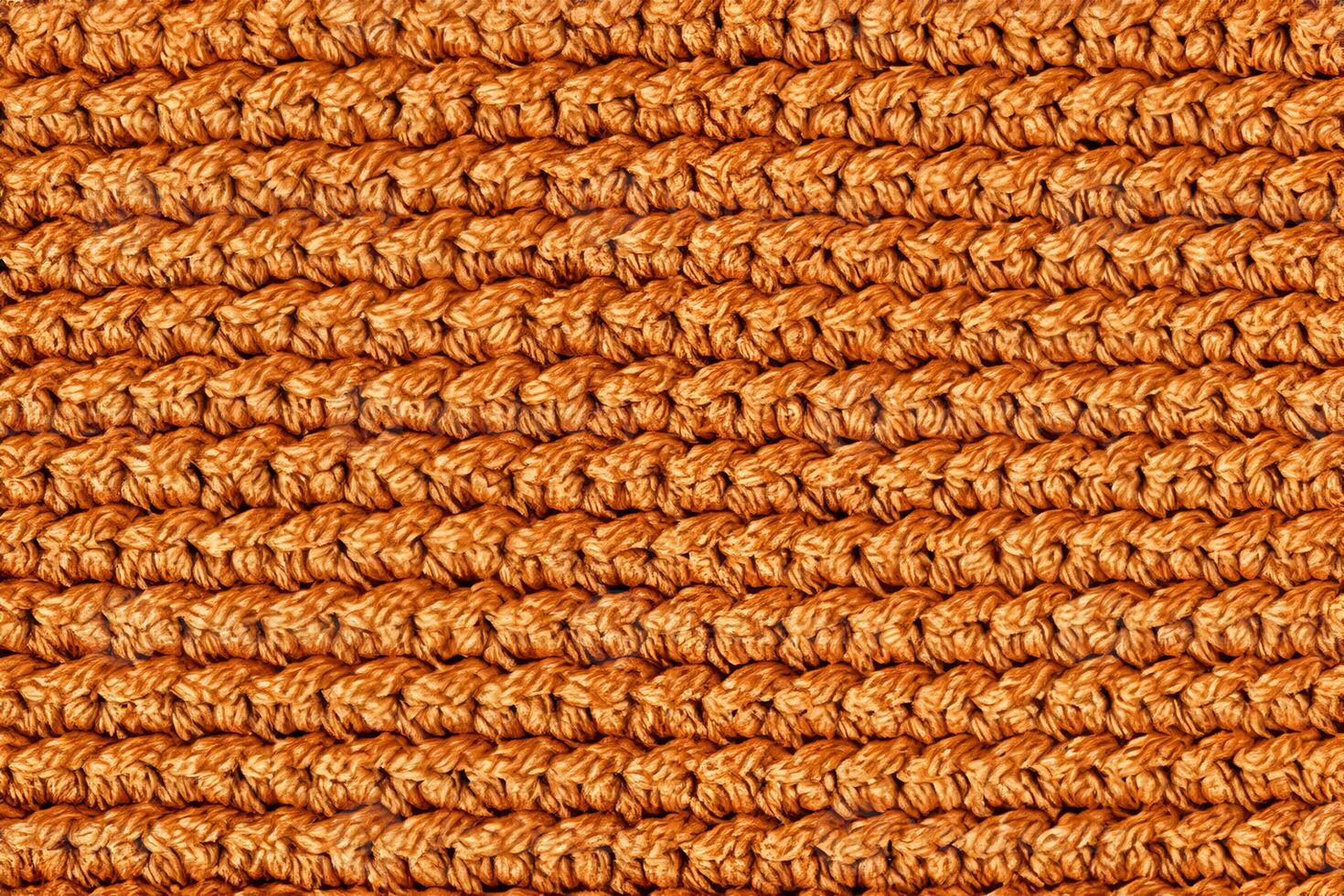 orange stickat tyg textur bakgrund. toppvy. kopiera, tomt utrymme för text foto