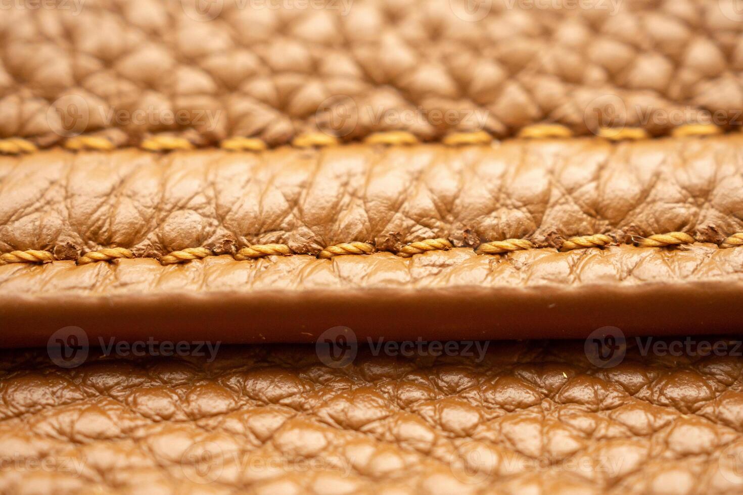 lyx brun läder väska textur bakgrund med söm foto