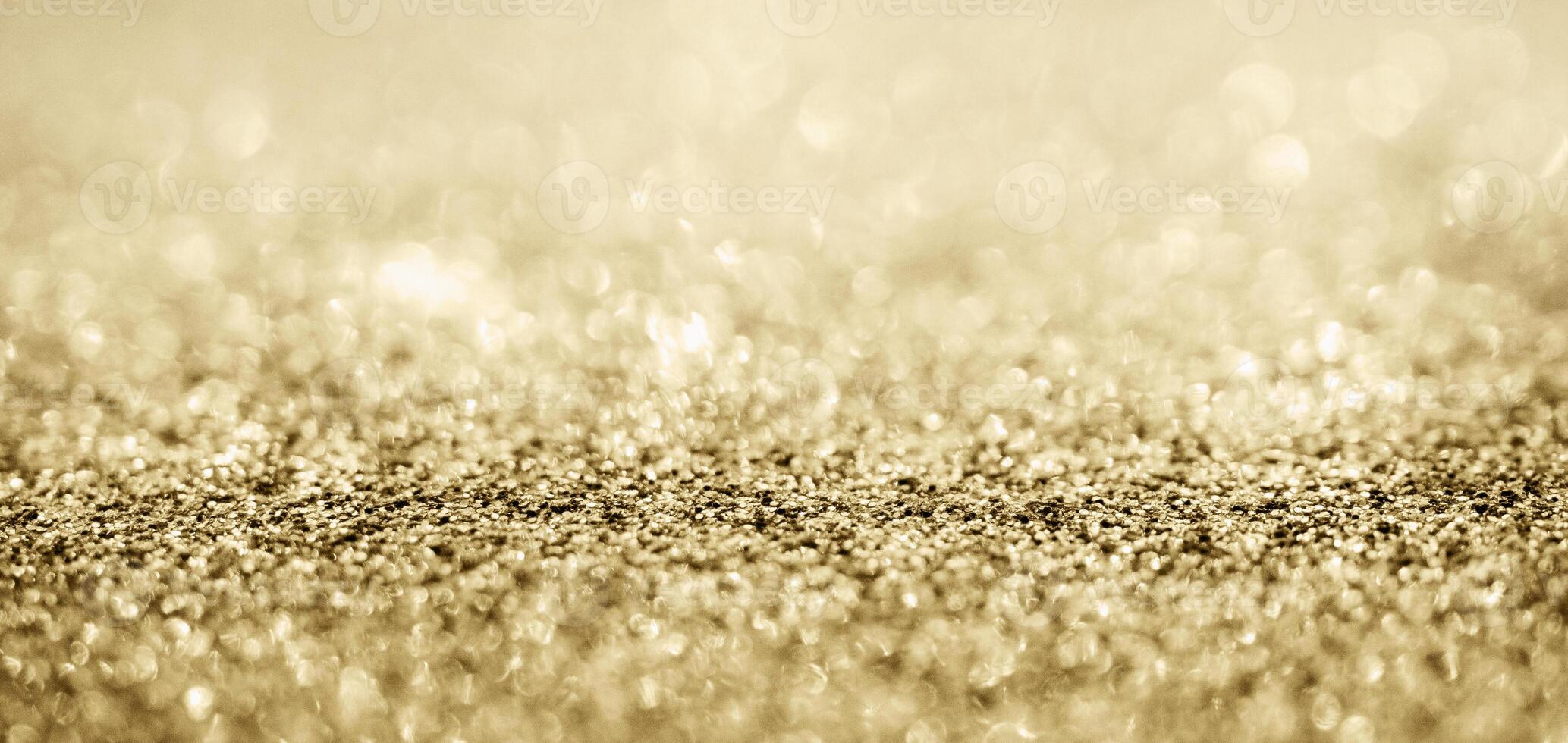 abstrakt guld glitter gnistra med bokeh bakgrund foto