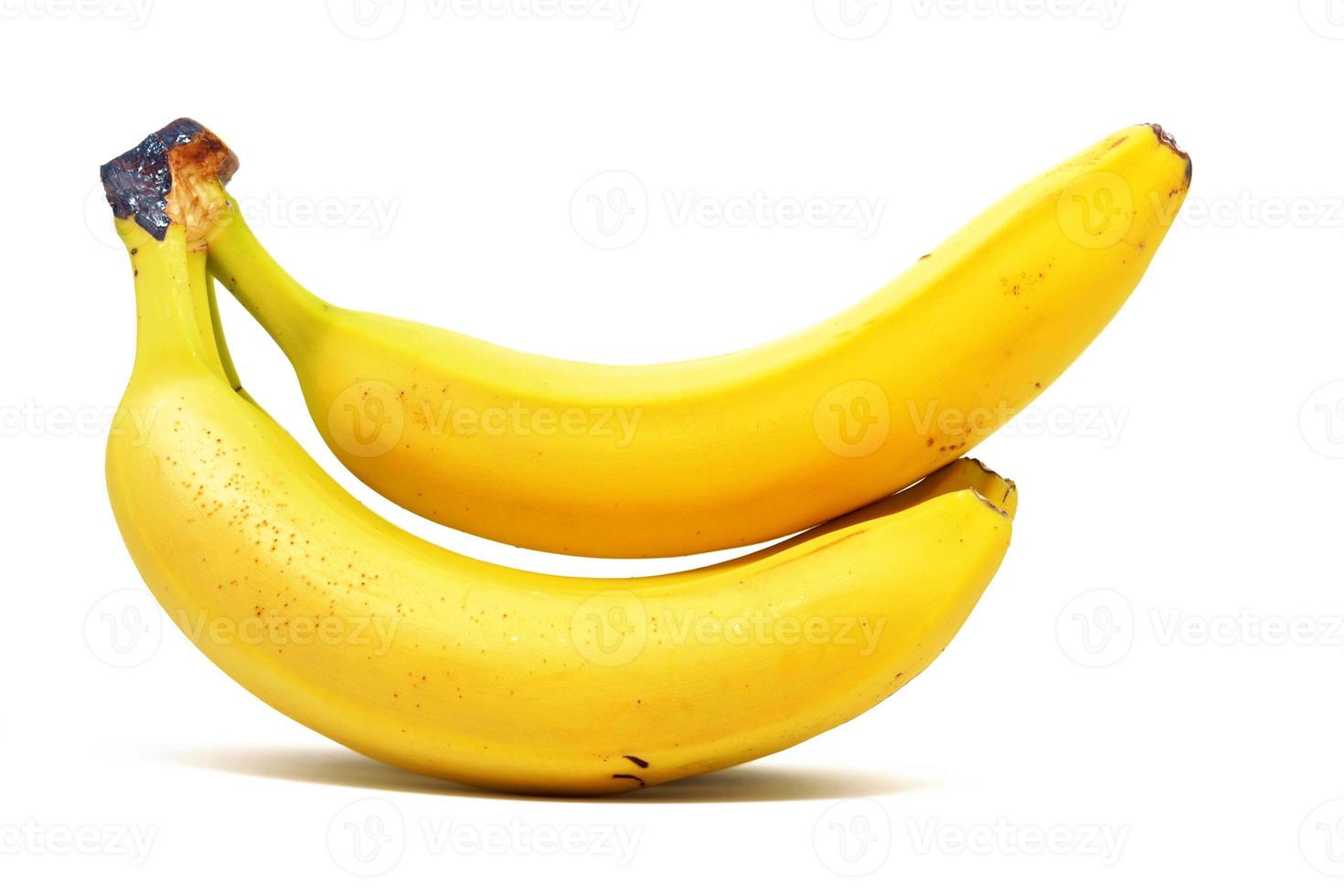två gula bananer på en vit bakgrund foto