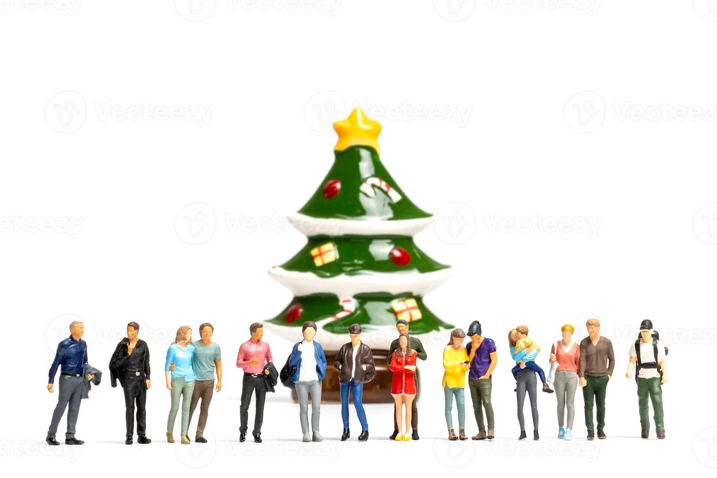 miniatyrmänniskor, en grupp människor som firar jul foto