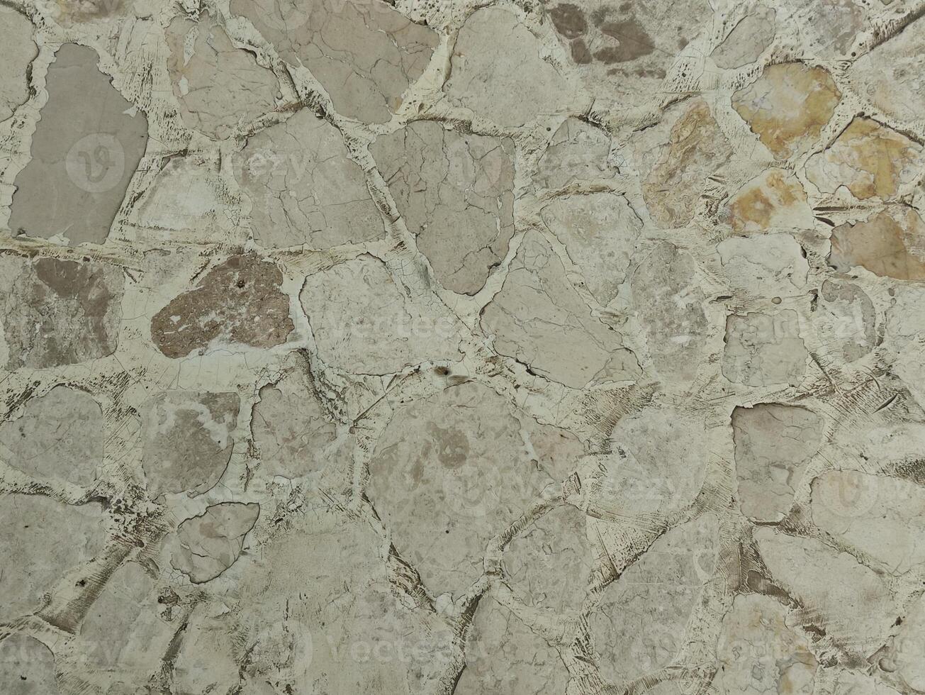 brun grädde sten vägg textur som är vanligtvis installerad på de väggar av hus eller lyx villor foto