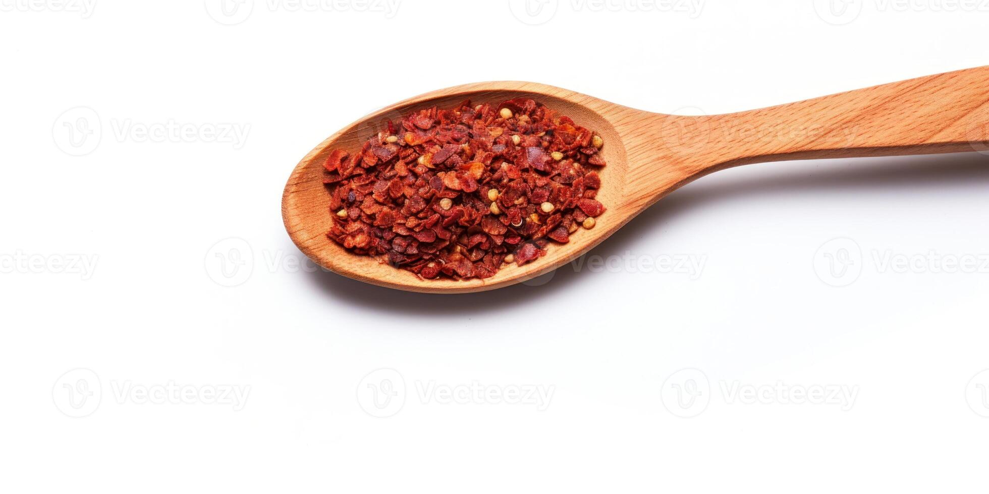 ai genererad chili peppar flingor i trä- sked på vit bakgrund. högen av krossad krydda paprika. lugg av krydda röd peppar flingor. topp se av kryddad krydda foto