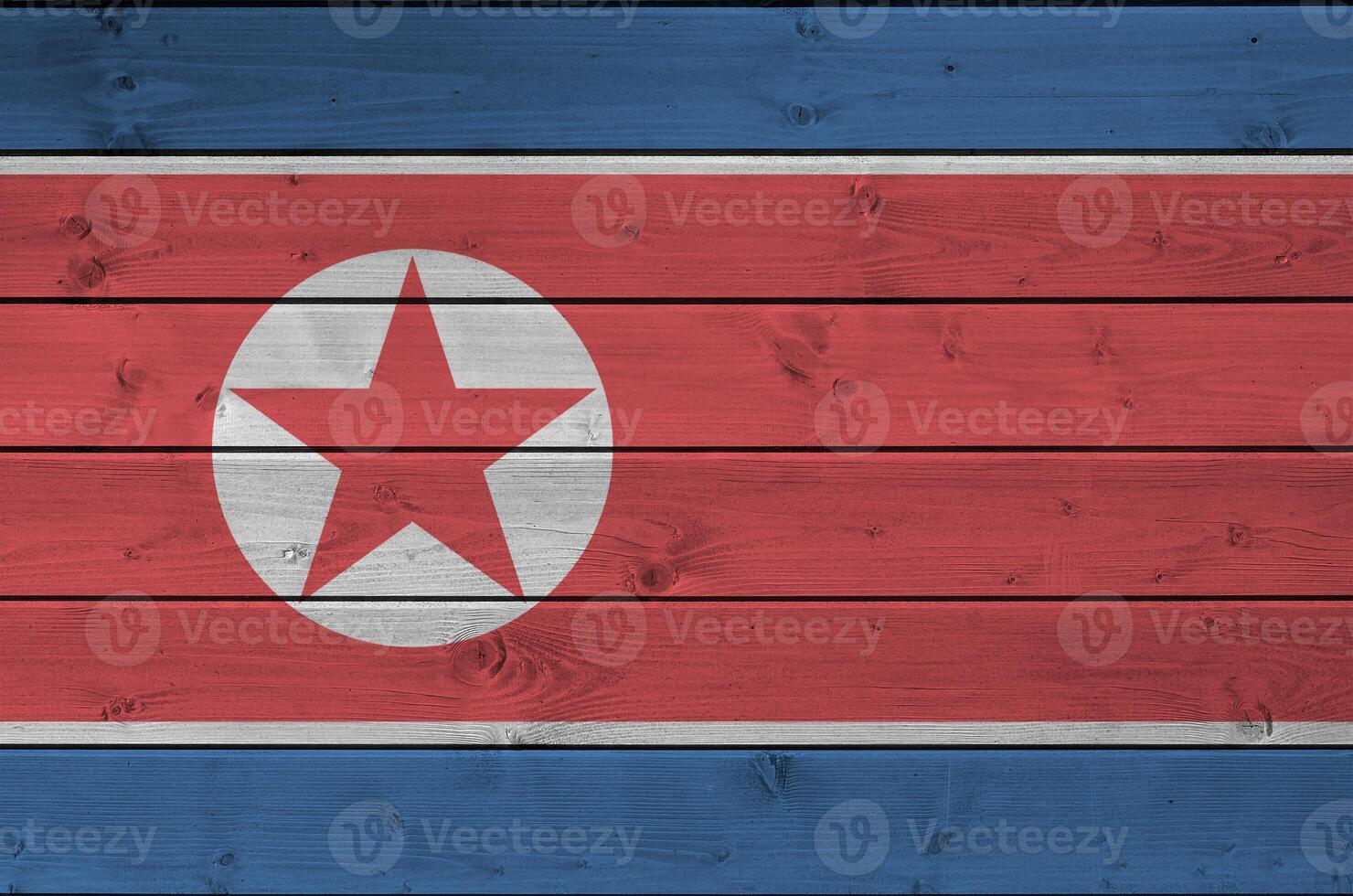 norr korea flagga avbildad i ljus måla färger på gammal trä- vägg. texturerad baner på grov bakgrund foto