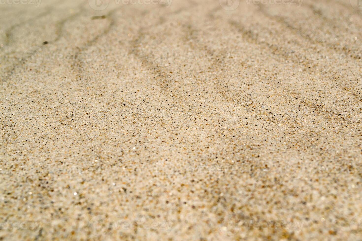 beige sand bakgrund. de sand textur. foto