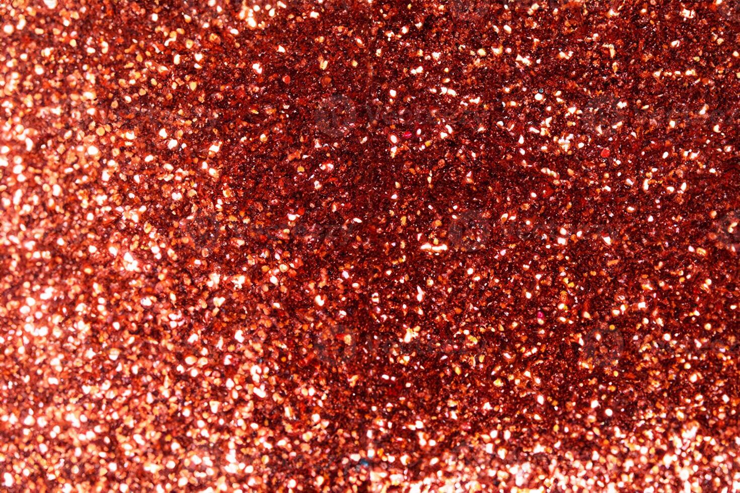 festlig röd gnistrande lampor bakgrund med abstrakt jul bokeh och faller stjärnor, perfekt för vinter- kort eller inbjudningar foto