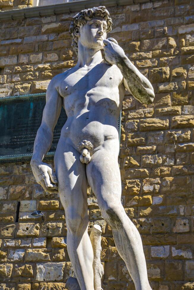 reproduktion av michelangelo-statyn David framför palazzo vecchio i Florens foto