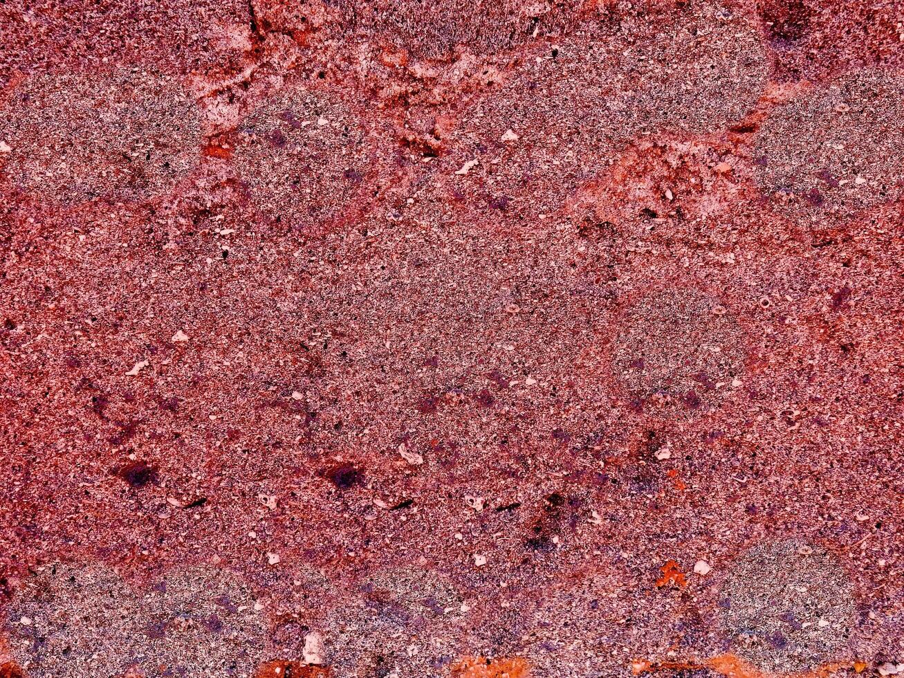 textur av röd sten i trädgården foto