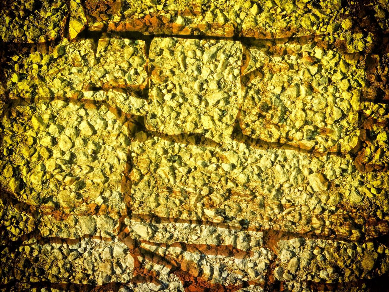 textur av gul sten i de trädgård foto