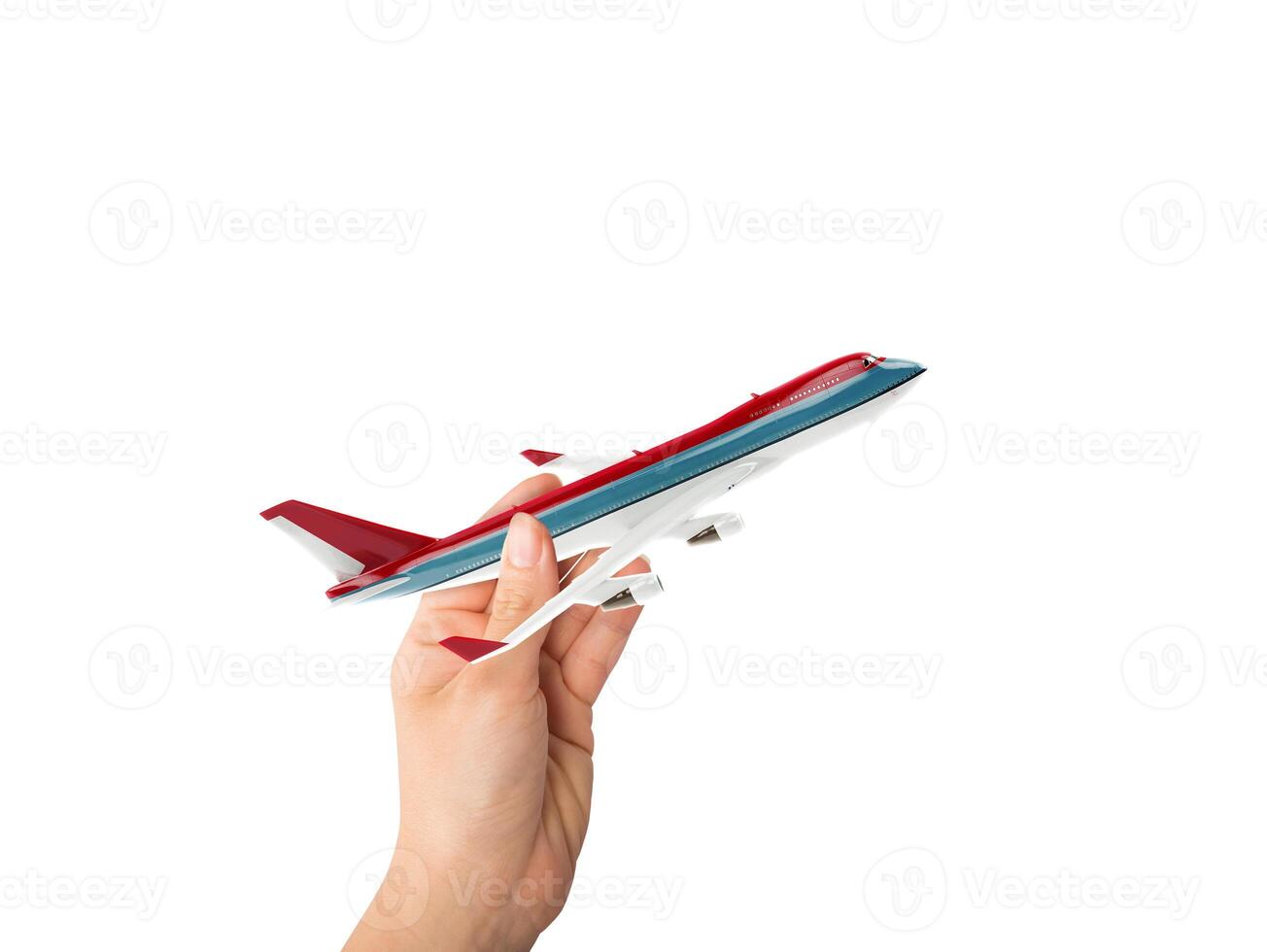 hand innehar en leksak trafikflygplan redo till flyga foto