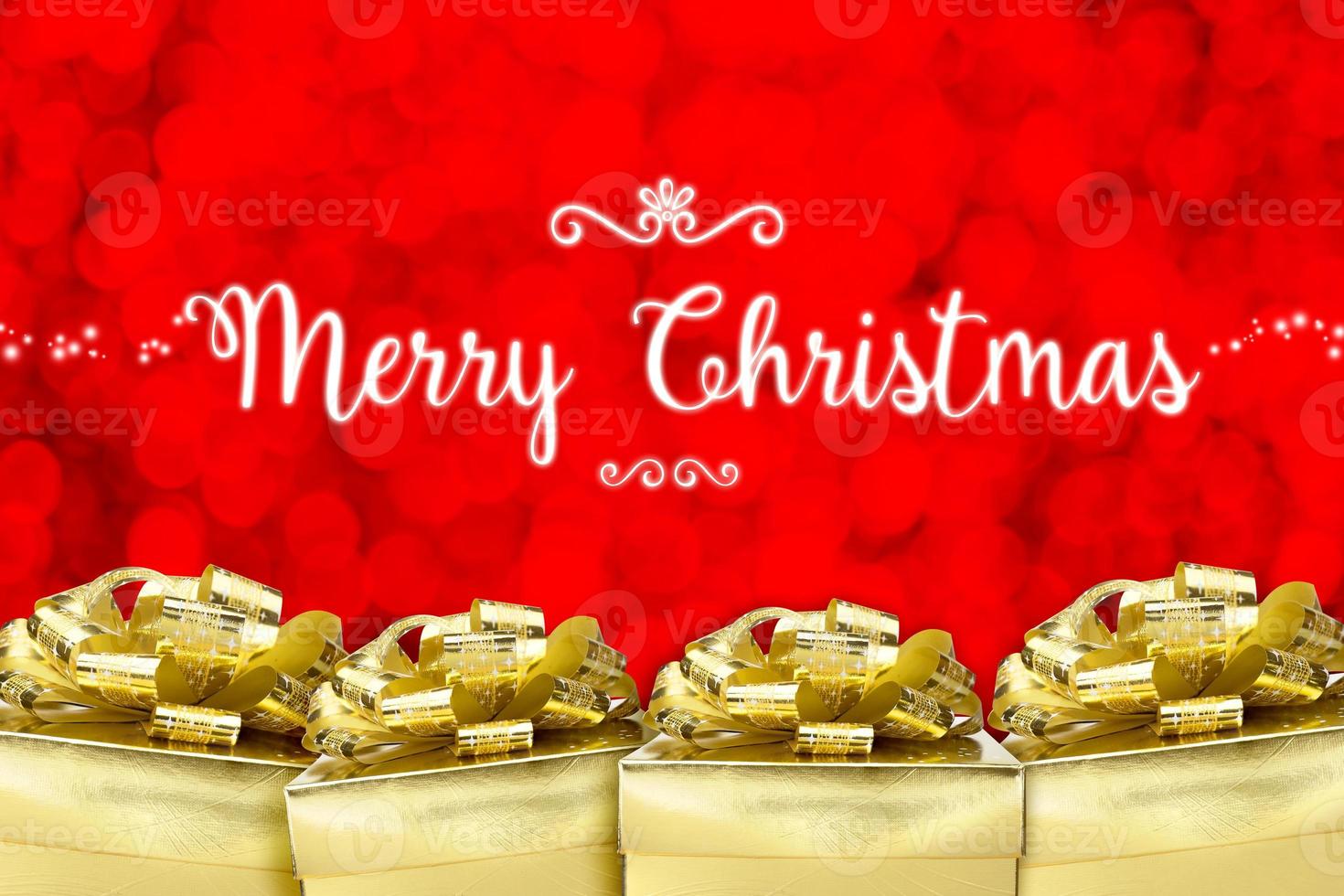 god jul ord med många gyllene färg närvarande med röd bokeh ljus bakgrund foto