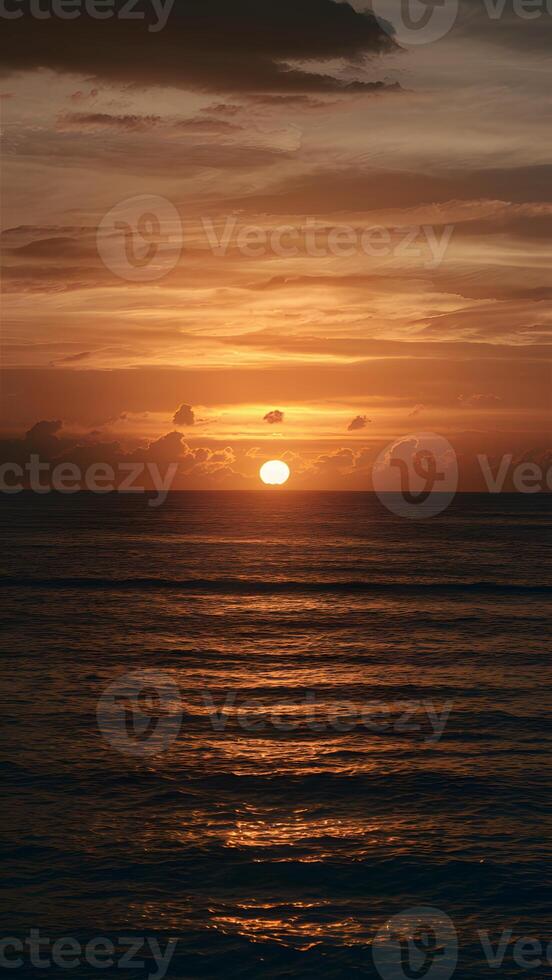 ai genererad gyllene nyanser belysa de horisont som gryning bryter över hav vertikal mobil tapet foto