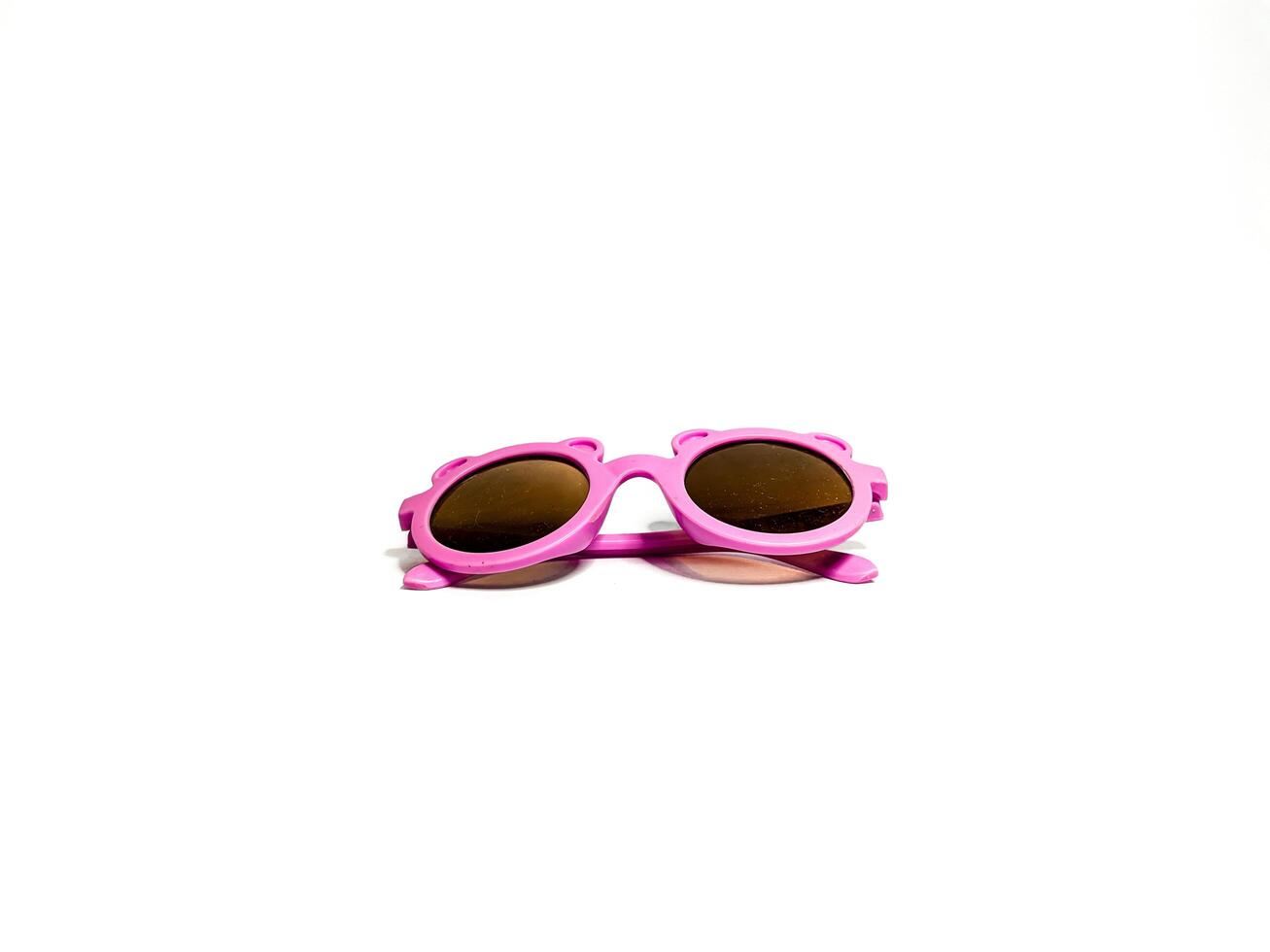 isolerat bild av en rosa barnets glasögon. tar bilder från de sida foto