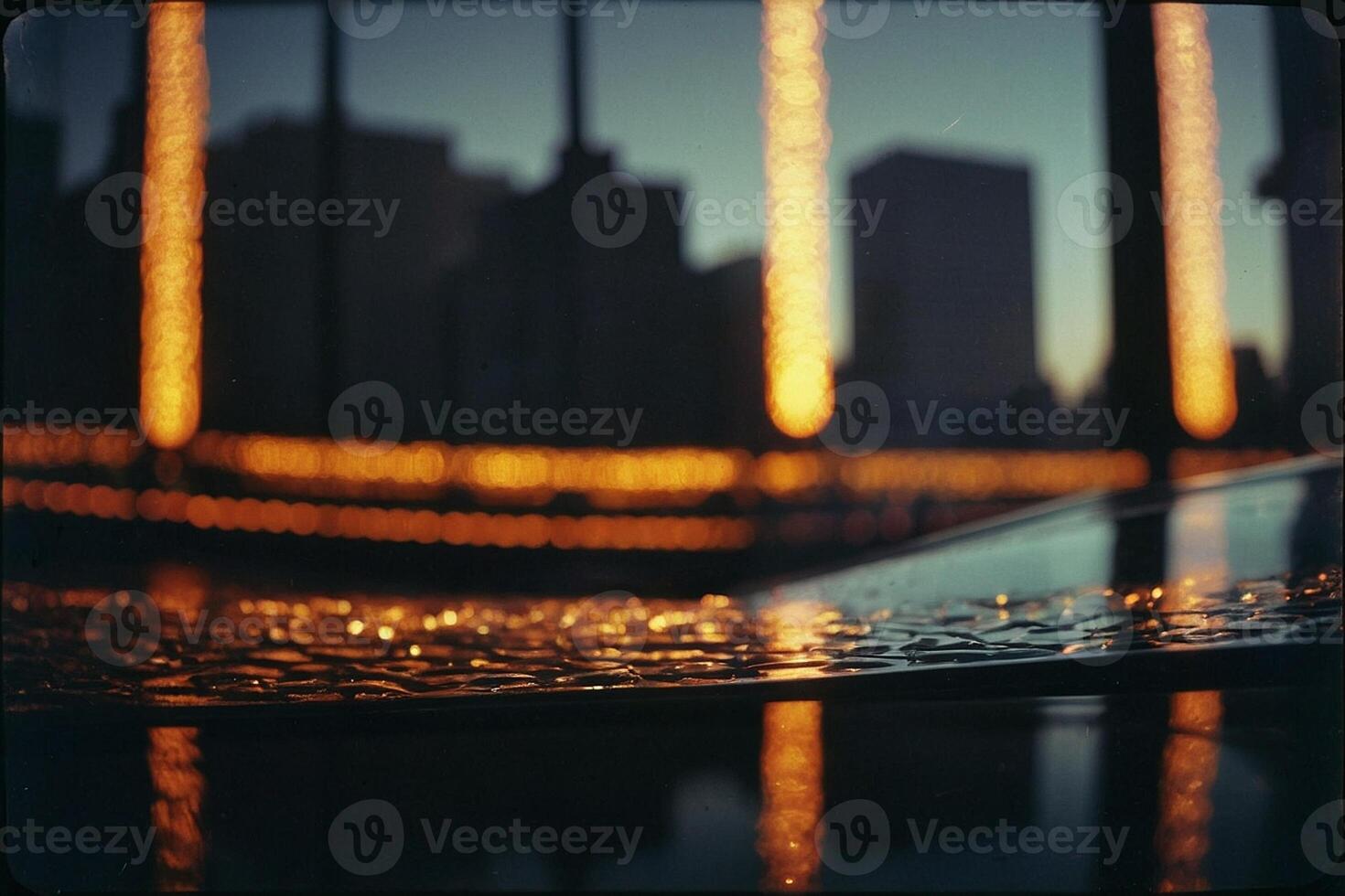 en stadsbild med lampor och vatten droppar på de jord foto