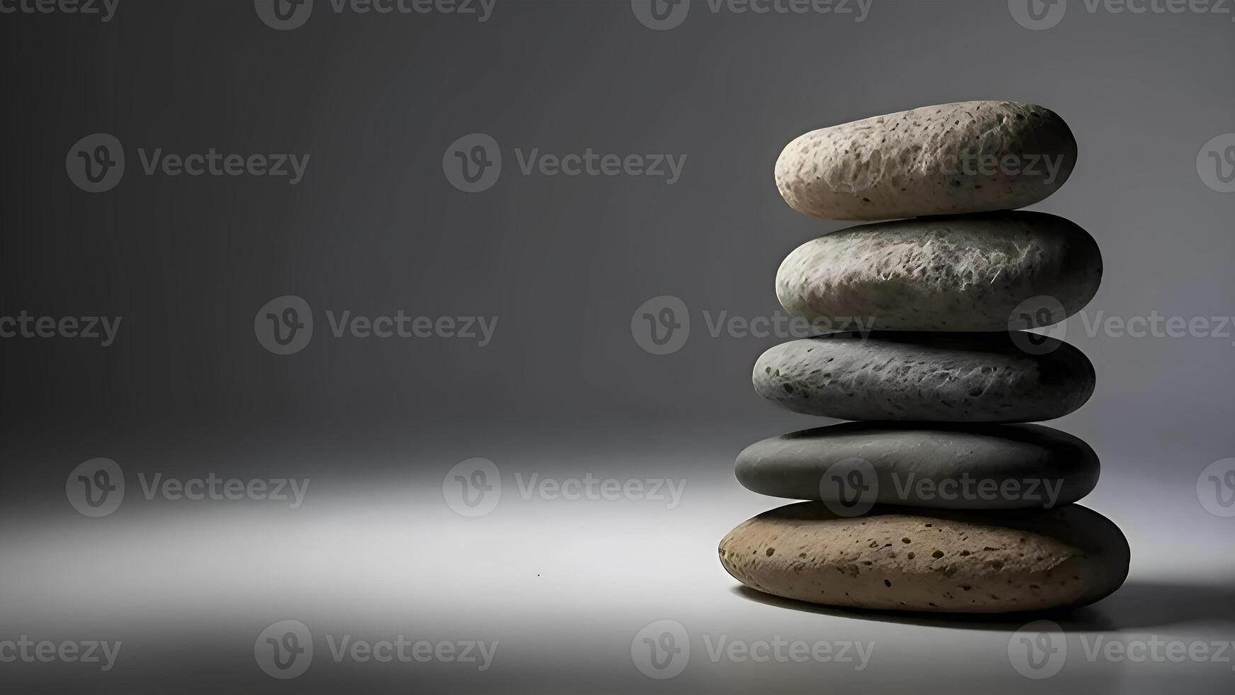stack av sten stenar på en mörk grå bakgrund, balans och harmoni bild begrepp foto
