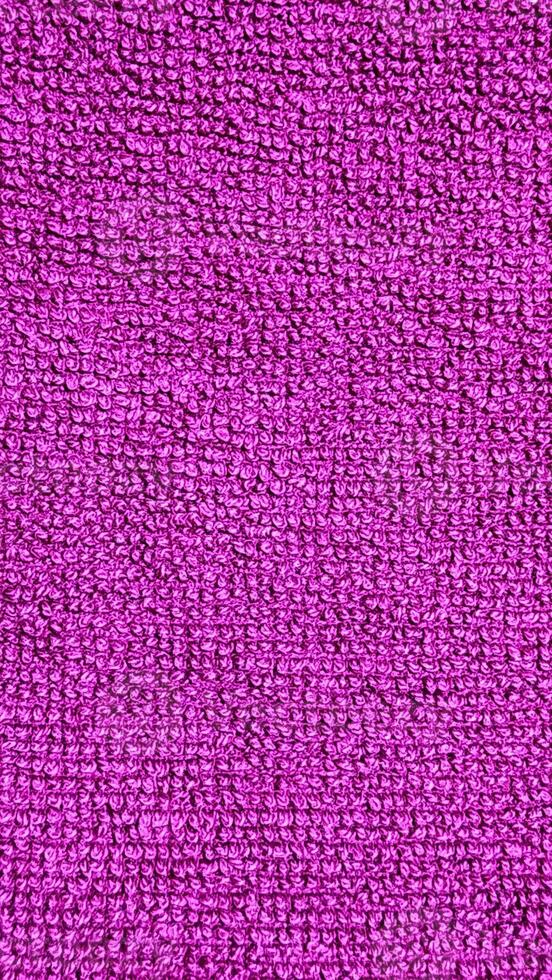 en lila handduk textur bakgrund foto