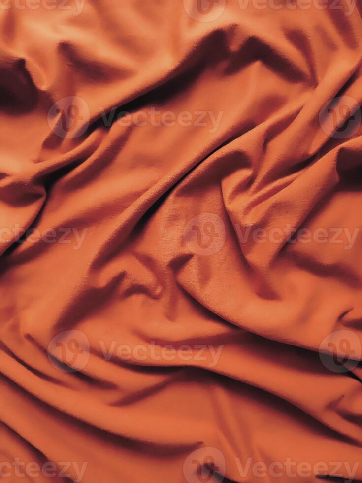 orange tyg bakgrund, silkig lutning lyx tyg textur, sommar textil- baner material tropisk Vinka se mode abstrakt design affisch mall foto