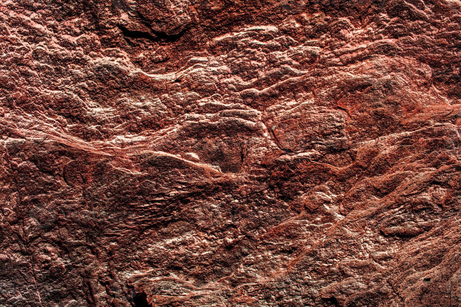 brun sten sten textur isolerade och enorm samling av granit stenar bakgrund foto