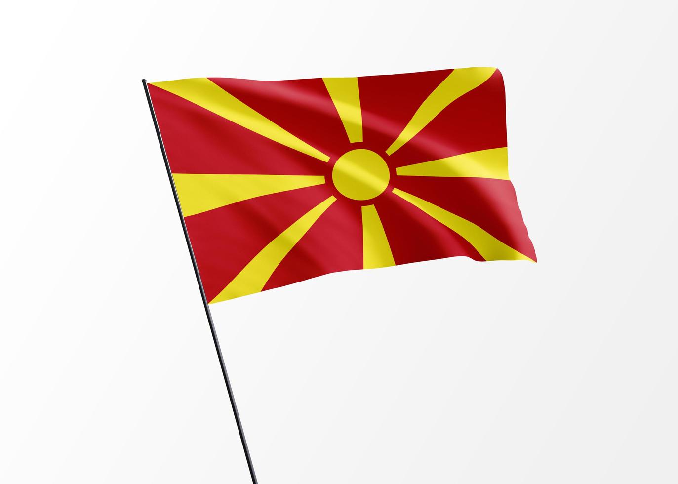 makedonska flaggan vajar högt i den isolerade bakgrunden makedonska självständighetsdagen. samling av världens nationella flagga foto
