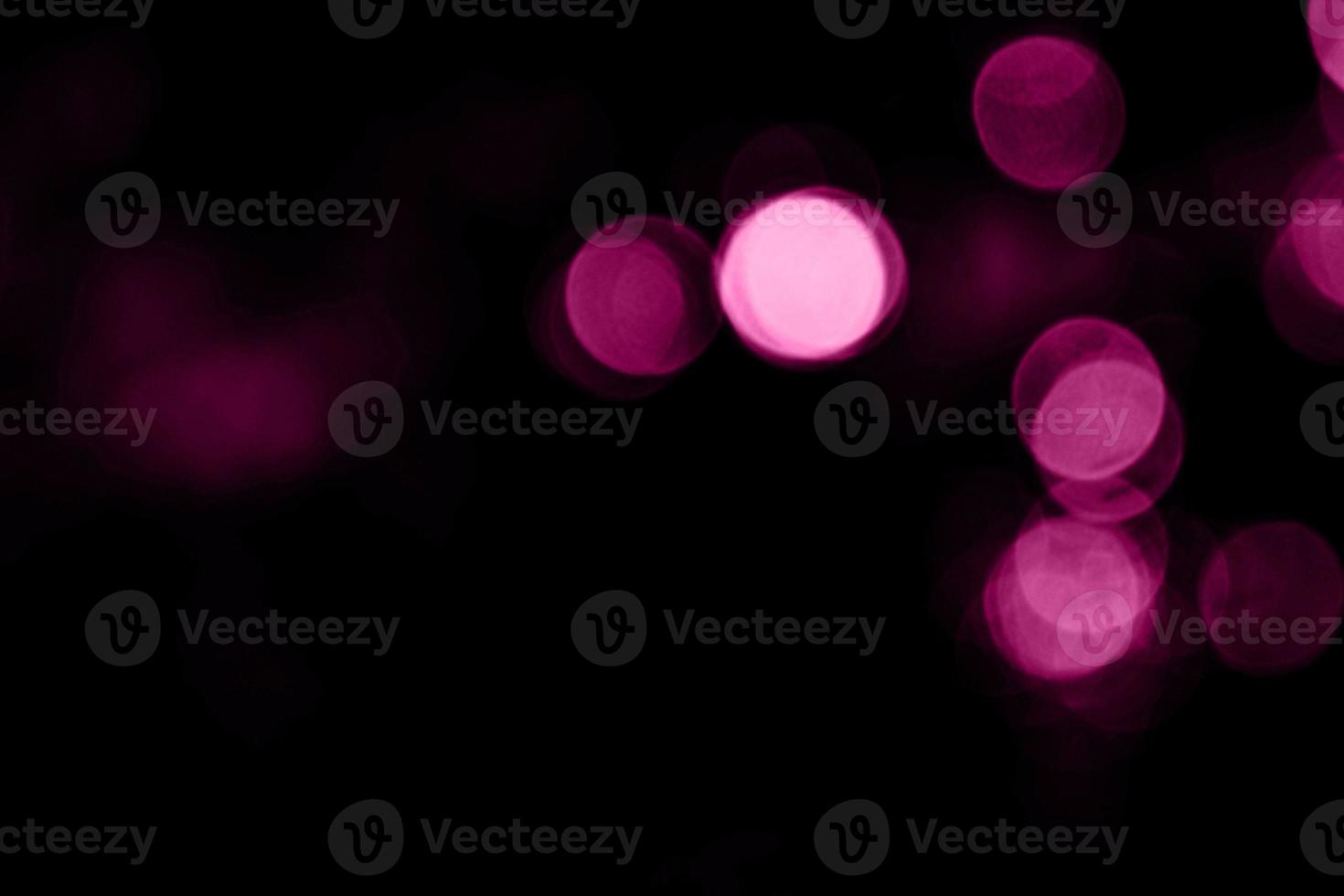 mångfärgad mörkrosa oskärpa bakgrund och cirkel bakgrund och abstrakt cirkel oskärpa julljus effekt foto