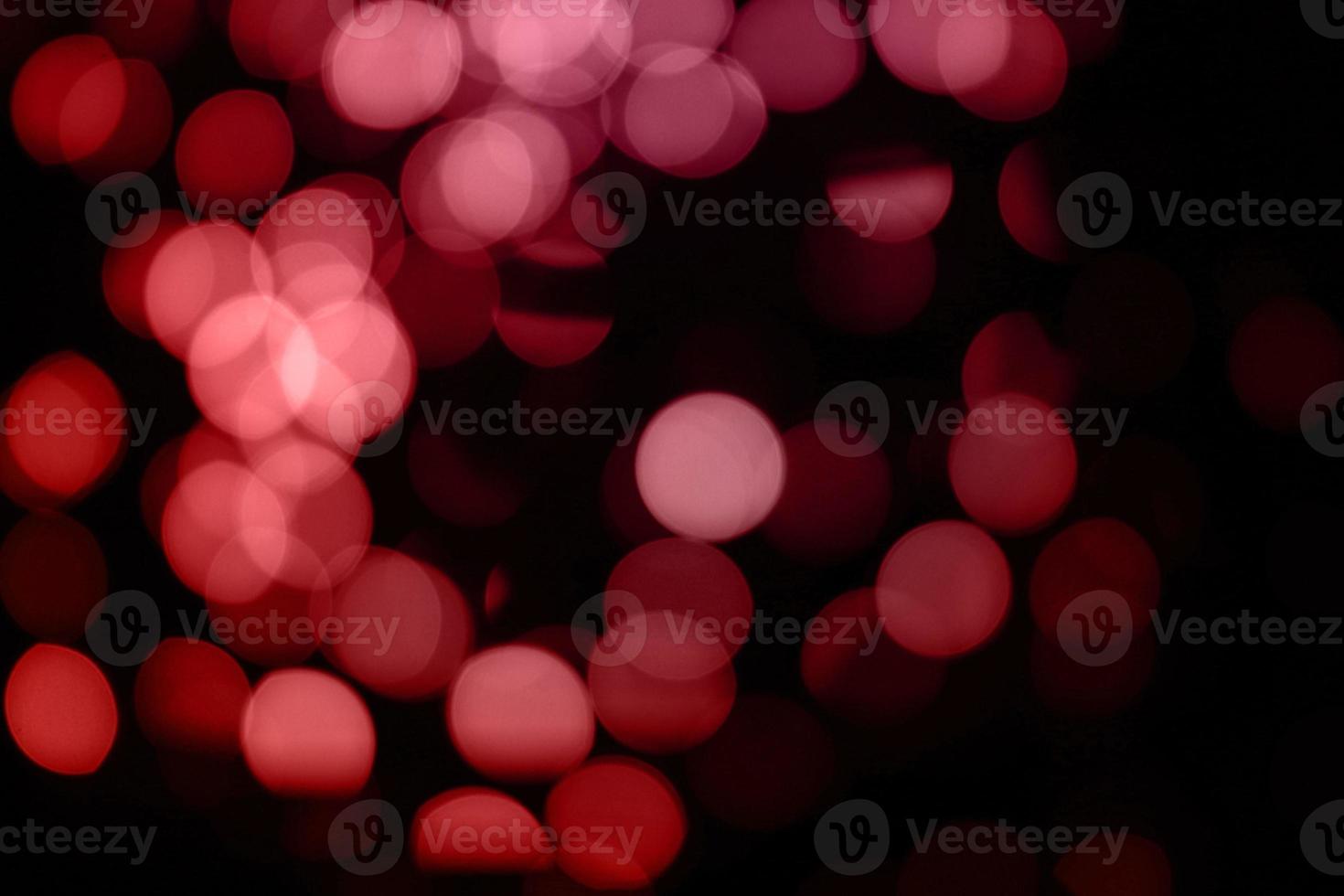 mångfärgad ljus röd oskärpa bakgrund och cirkel bakgrund och abstrakt cirkel oskärpa julljus effekt foto
