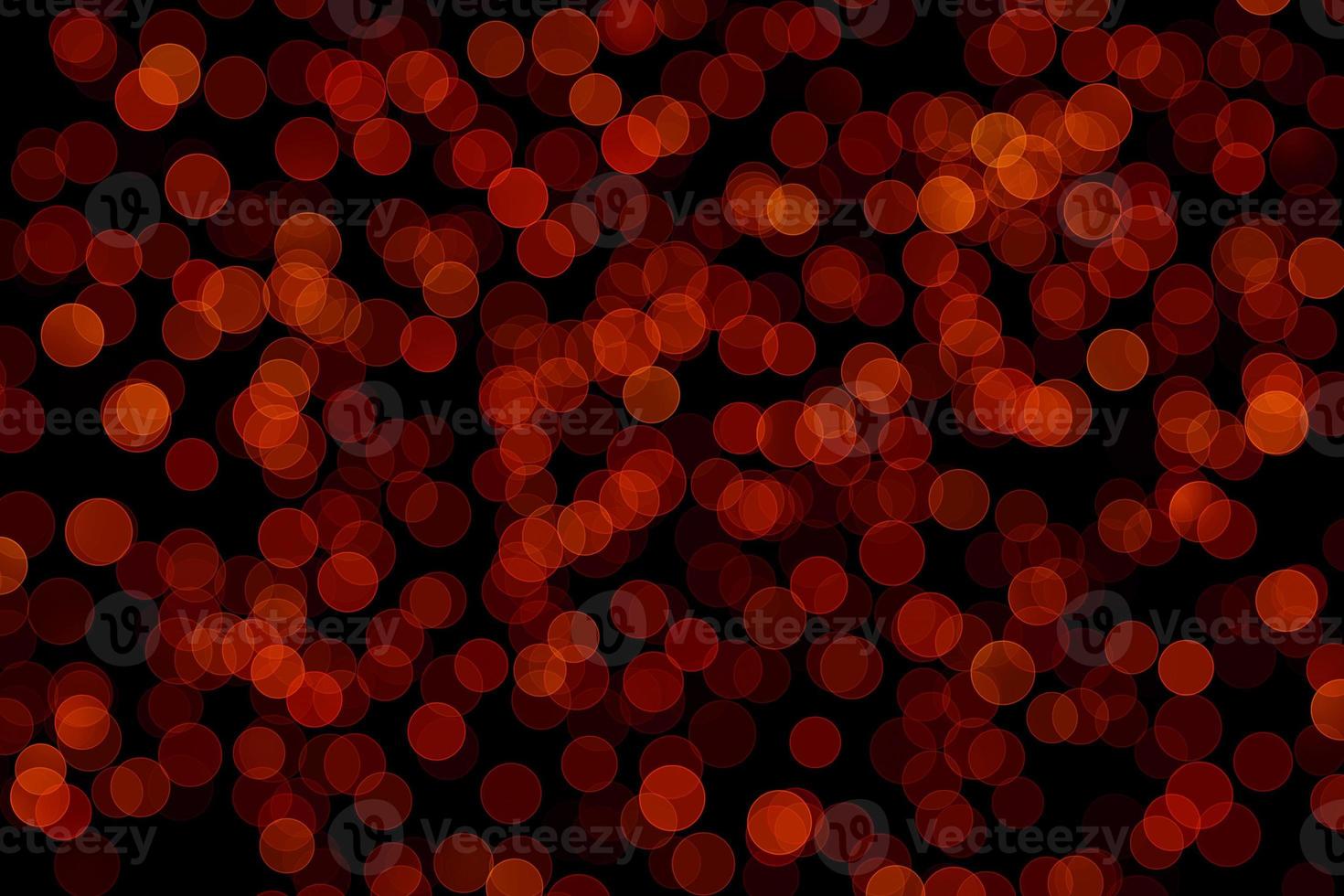 röd oskärpa effekt svart bakgrund. abstrakt svart ofokuserad oskärpa ljusa prickar svart. foto
