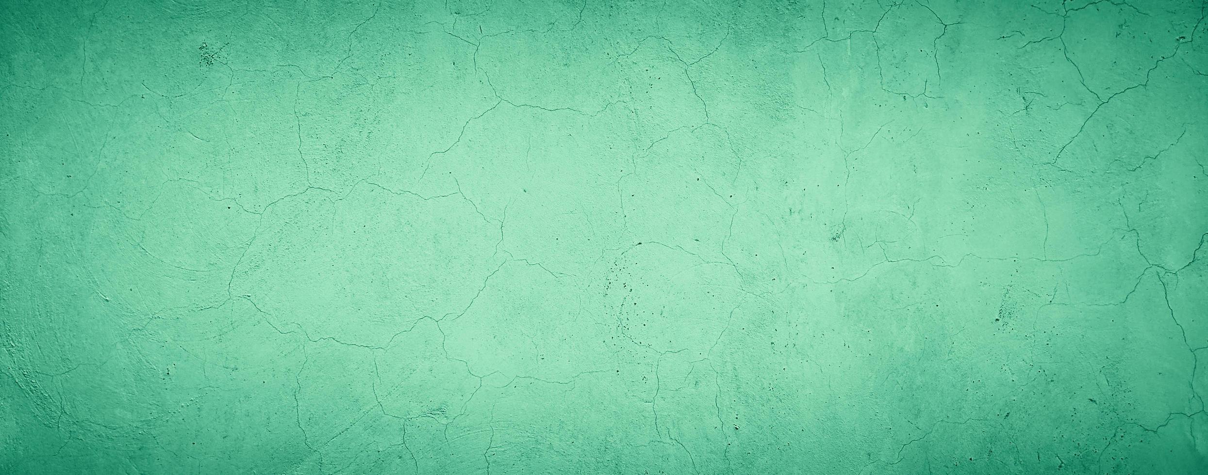 abstrakt grungy betongvägg textur bakgrund med grön pastellfärg foto