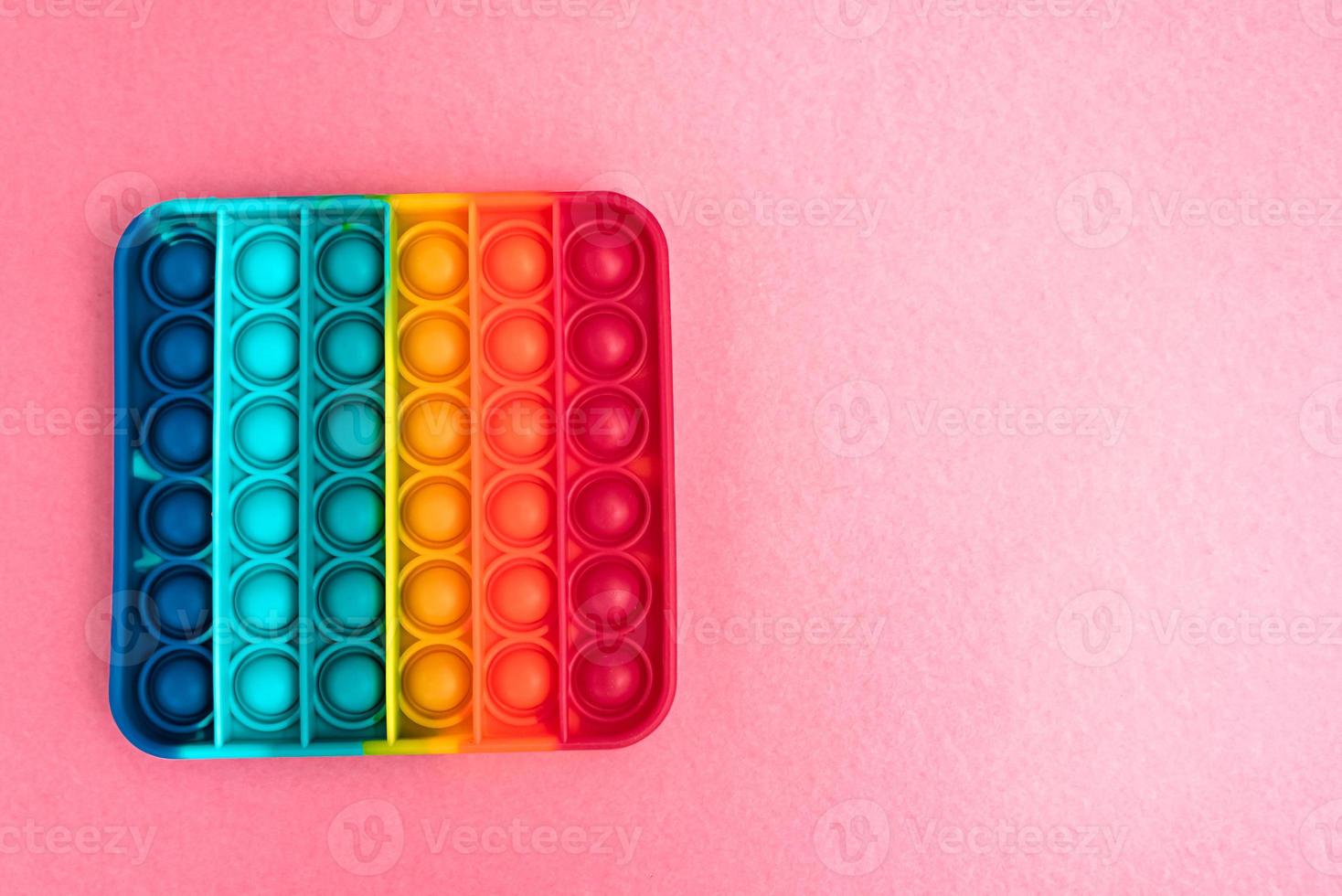 fidget pop it toy regnbågsfärg, antistress, roligt och lärorikt foto