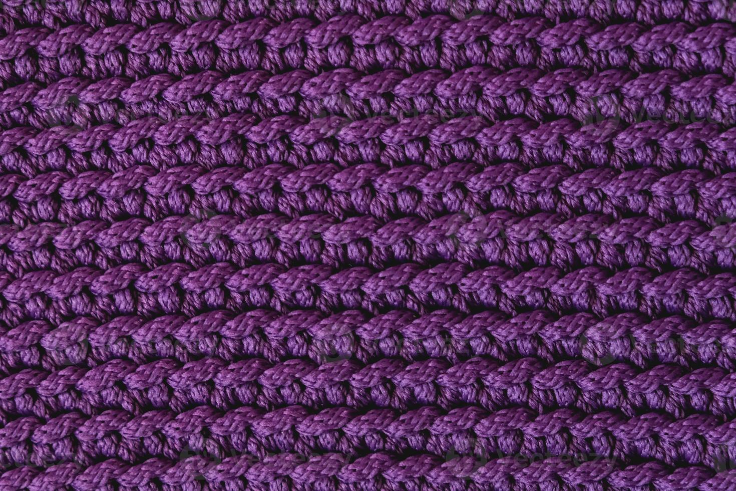 violett stickat tyg textur bakgrund. toppvy. kopiera, tomt utrymme för text foto