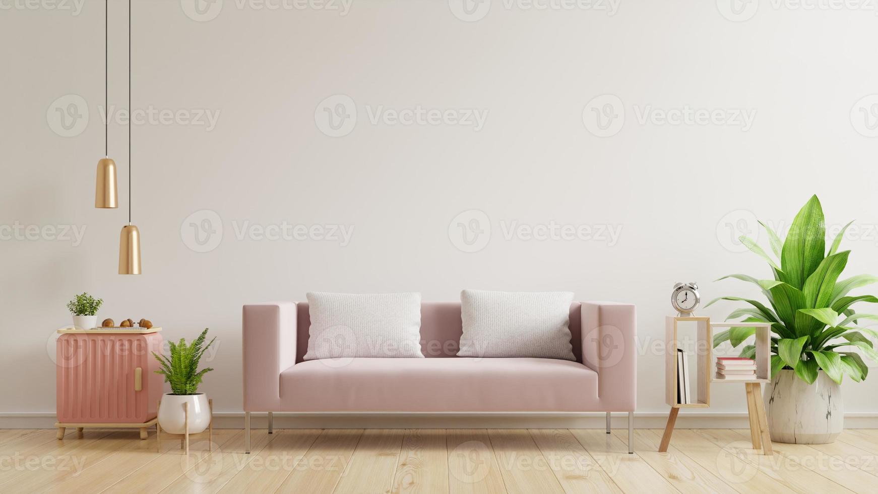 invändig väggmockup med tom vit vägg, rosa soffa på trägolv och vit vägg. foto