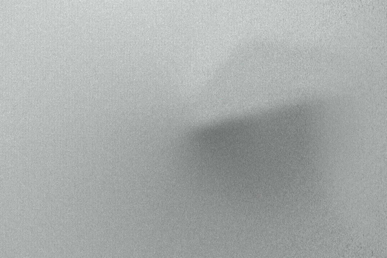 borstad ljusgrå våg metallisk plåt, abstrakt textur bakgrund foto
