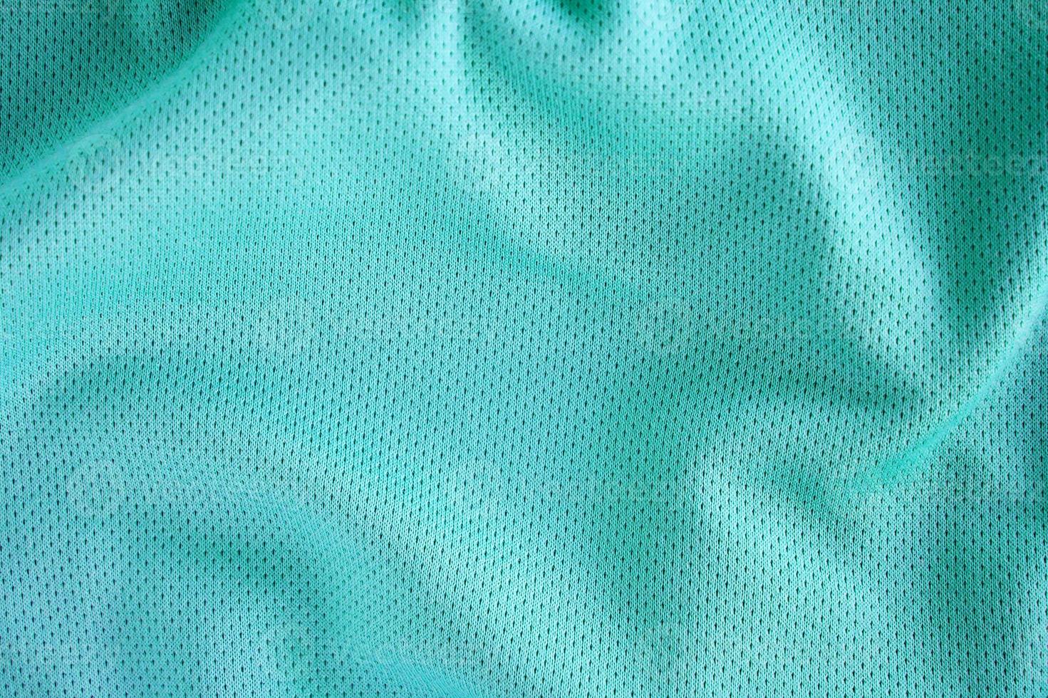 sportkläder tyg textur bakgrund, ovanifrån av tyg textil yta foto