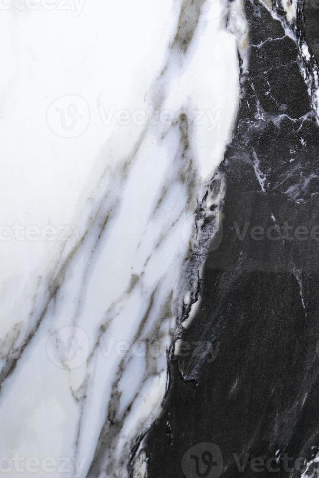svart marmor med vita mönster vägg- eller golvbeläggningar i inredningsarbete, textur bakgrund foto