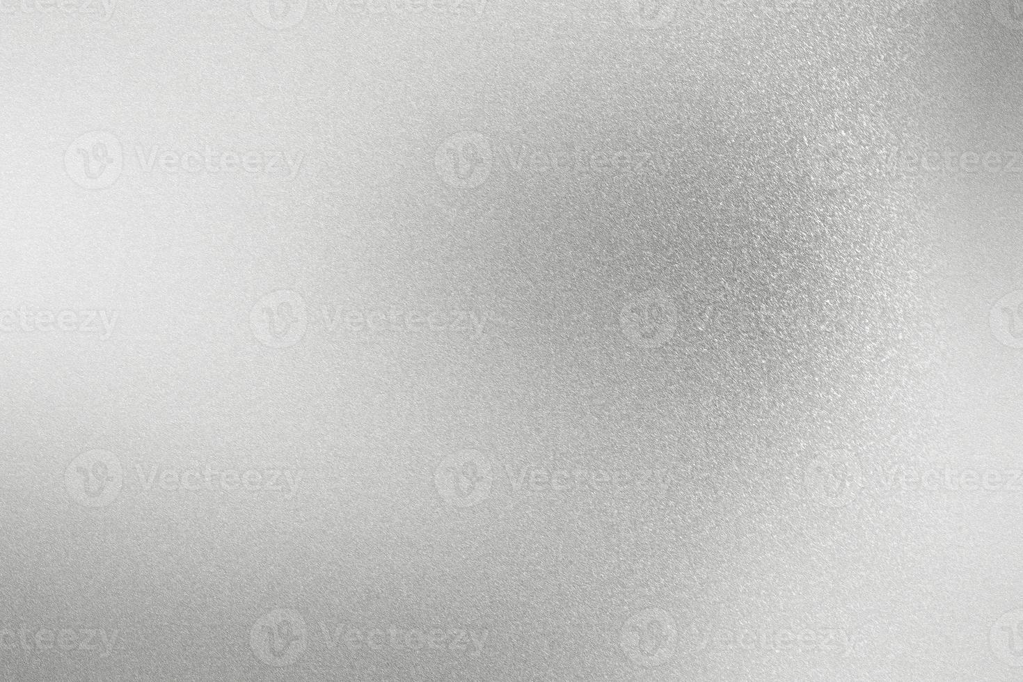 glänsande grov silver metall vägg, abstrakt textur bakgrund foto