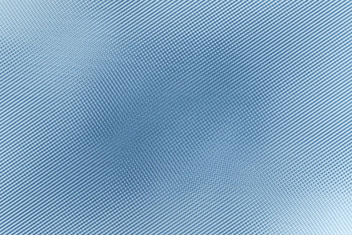 diagonal linjestruktur på blå plastvägg, abstrakt bakgrund foto
