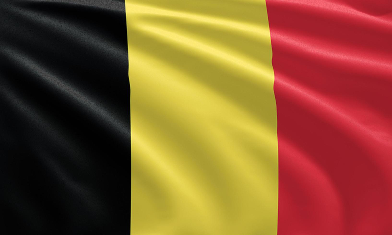 närbild viftande Belgiens flagga foto