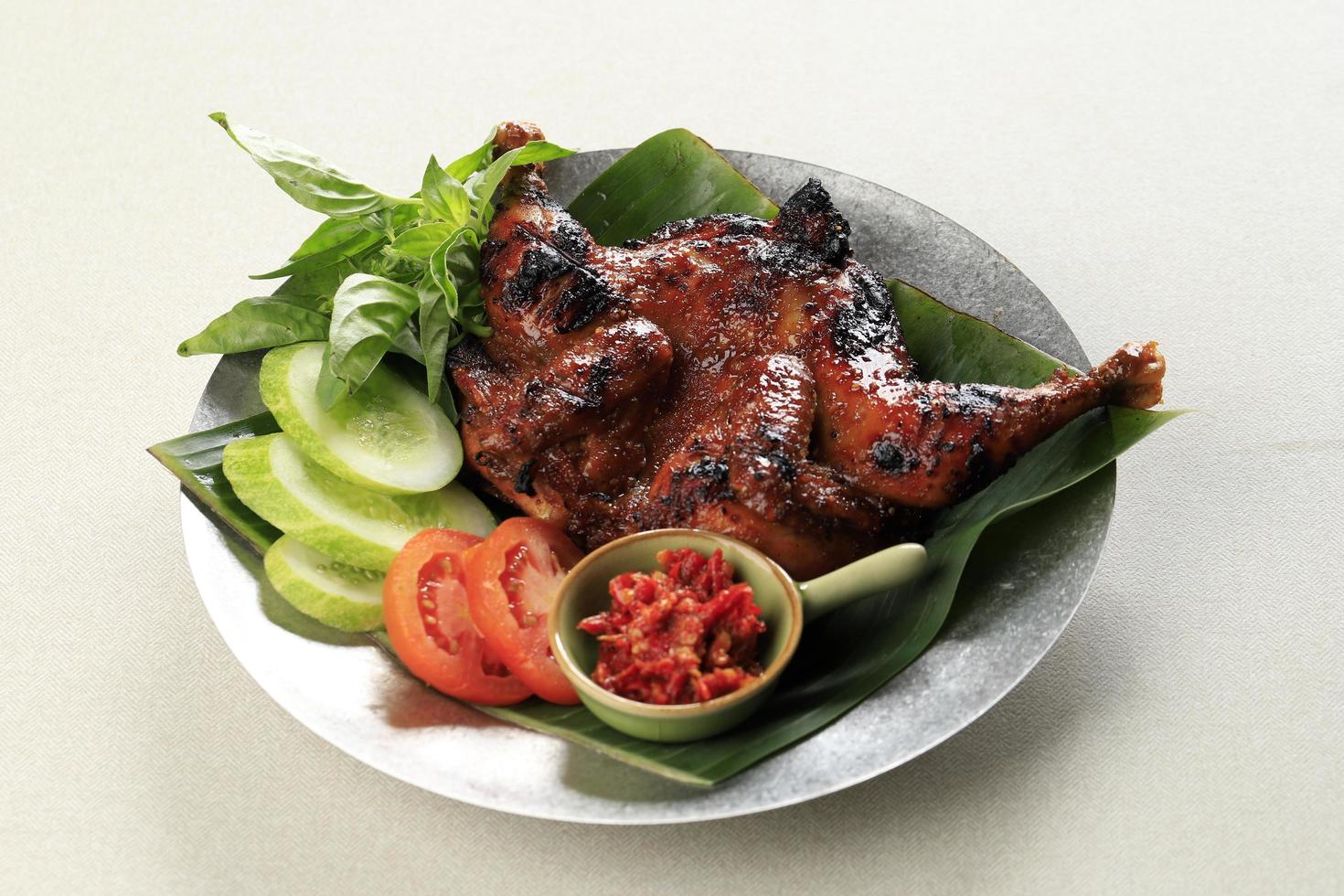 ayam bakar madu, rostad kyckling med honung, ört och krydda från Indonesien foto