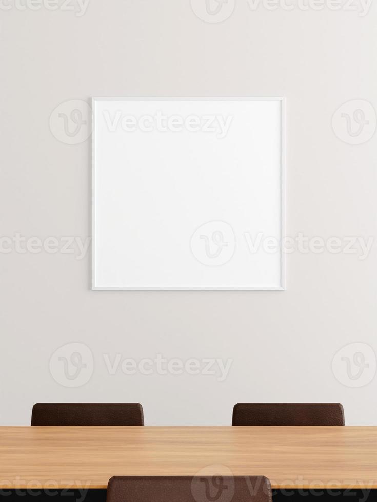 minimalistisk fyrkantig vit affisch eller fotoram mockup på väggen i kontorets mötesrum. foto