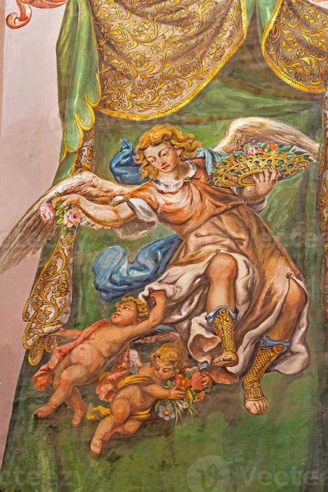 Sevilla - fresco av ängel med rosorna foto