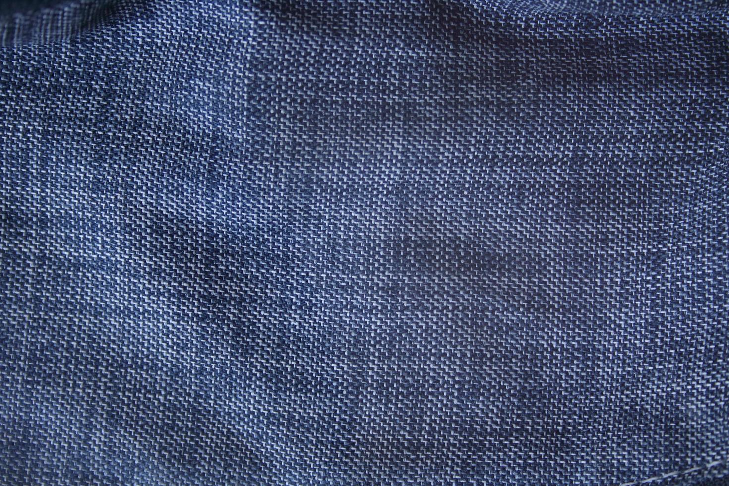 mörkblå textil bakgrund, indigo tyg tyg bakgrund. foto