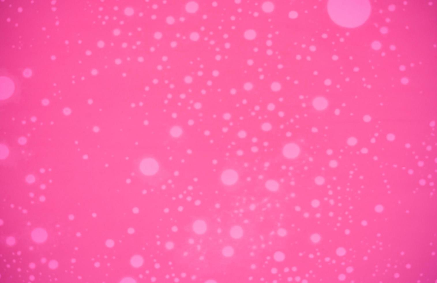 rosa textur bakgrund med vita prickade mönster. alla hjärtans dag bakgrund med kopia utrymme för text. foto