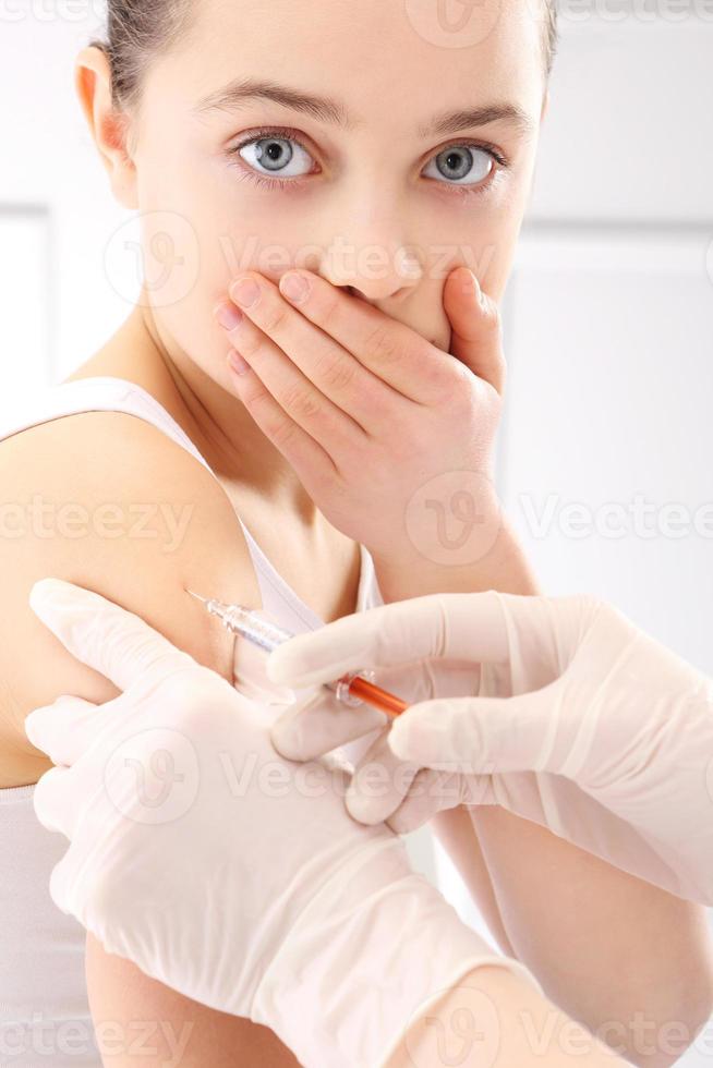 skrämd barnvaccination foto